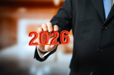 The year 2026 in the hand of a man in a suit. New Year, plans for the future, and business trends....