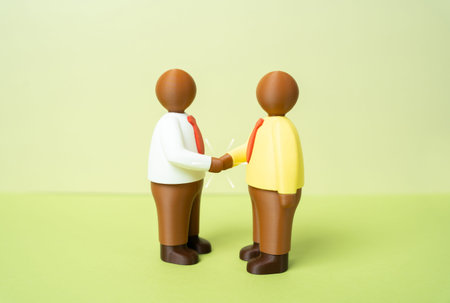 Two office workers shaking hands. Human figures. Agreement and communication. Introductions and...