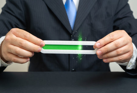 A businessman holds a filling progress bar scale. Productivity, income level. Visual story about...