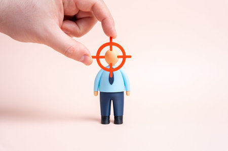 An office worker in the center of the targeting circle. Headhunting and recruiting specialists in...