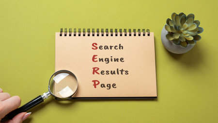 Notepad with the word SERP - Search Engine Results Page. Pages displayed by search engines in...
