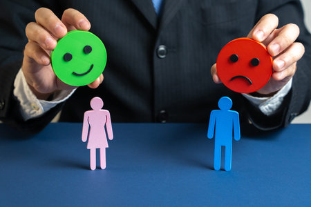 Psychologist holds a happy and angry emoji over a man and a woman. Symbol of conflicts, doubts, and...