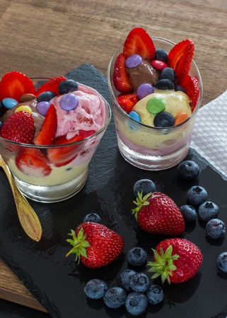 Ice cream BlackBerry and strawberry in the shape of a ball, with fresh berries.selective focusの写真素材