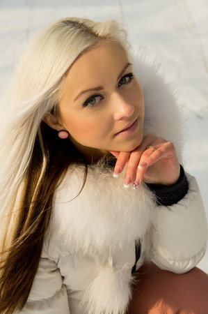 a young girl in the forest in winterの写真素材