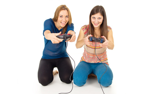 sisters play video games on the joysticks