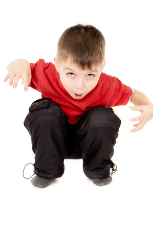 the little boy screaming and writhe a face isolated on white backgroundの写真素材