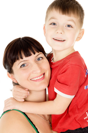 a happy mother embraces her child isolated on white backgroundの写真素材