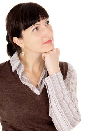 A beautiful young sexy black-haired woman thinks isolated on white backgroundの写真素材