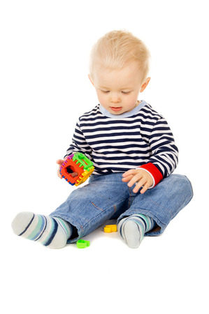 kid plays with toys isolated on white backgroundの写真素材