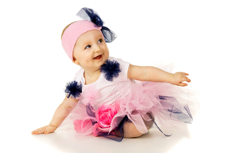 beautiful girl in a festive costume sittingの写真素材