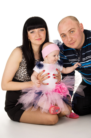 Portrait of a beautiful and happy family isolatedの写真素材