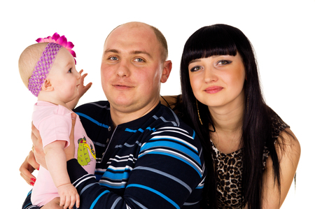 Portrait of a young family with baby isolatedの写真素材