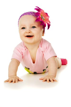 portrait of a little girl with a flower on her headの写真素材