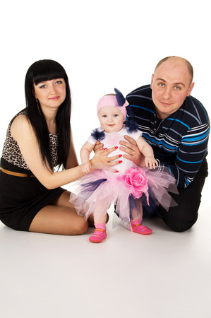 Mom, dad and baby isolated on white backgroundの写真素材