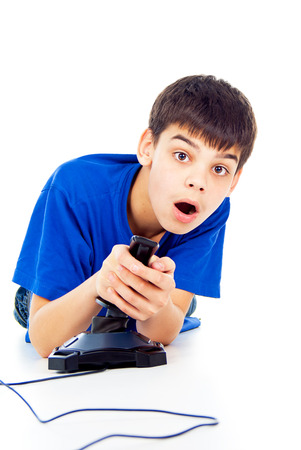 boy plays games on the joystickの写真素材