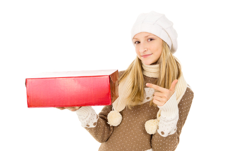 girl in winter hat with a giftの写真素材