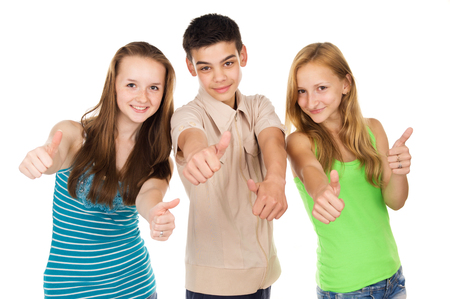 Young friends show a sign of goodの写真素材