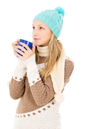 teen girl in winter hat with cupの写真素材