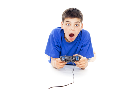 Boy playing computer games on the joystickの写真素材