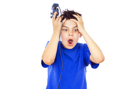 beautiful guy plays video games on the joystickの写真素材