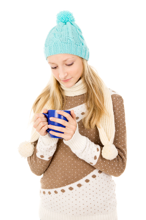 teen girl in a cap with a mugの写真素材