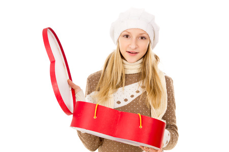 teenager holding heart shaped box isolatedの写真素材
