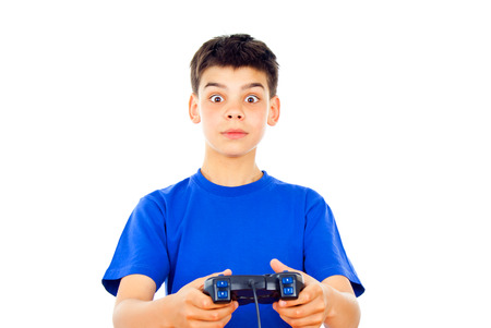 Boy playing computer games on the joystickの写真素材