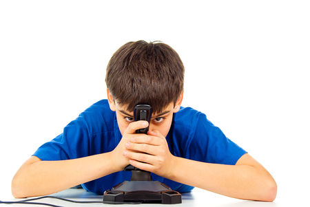 boy tired to play a video game joystick isolatedの写真素材