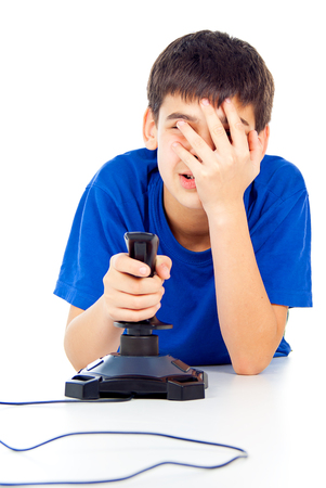 boy plays on the joystickの写真素材