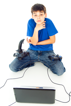 boy with computer and with two joysticksの写真素材