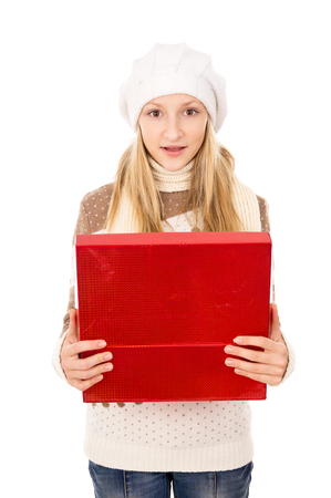 girl looks in a gift boxの写真素材