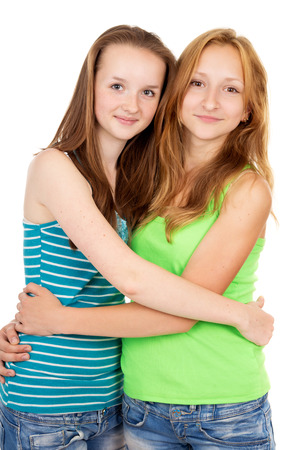 Beautiful young sisters huggingの写真素材