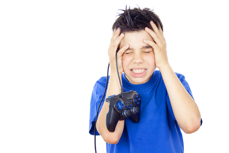 child plays games on the joystickの写真素材
