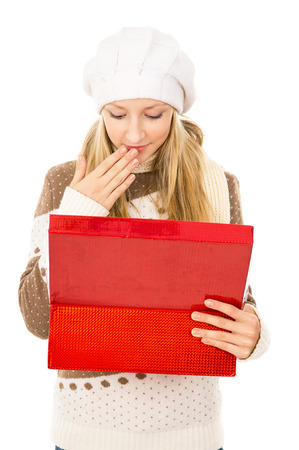 girl looks in a gift box and wonderingの写真素材