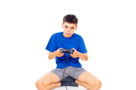 boy with a joystick playing video gamesの写真素材