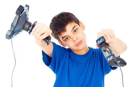 boy with two joysticks plays video gamesの写真素材