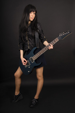 A girl playing the guitarの写真素材