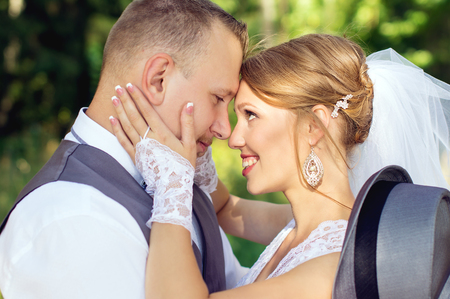 Happy bride and groom looking into the eyesの写真素材