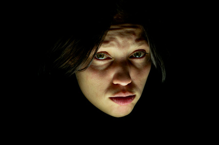 the girl cries sad in the dark