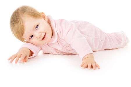 beautiful little baby learns to crawl isolated on white backgroundの写真素材