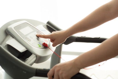 Woman exercising and working out in fitness gymの写真素材