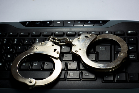 Handcuffs on keyboard