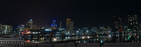 Night panorama at Victoria Harbor in Docklands with lights reflections in water, marina piers, posts and boats and CBD lights in background in Victoria, Australianのeditorial素材