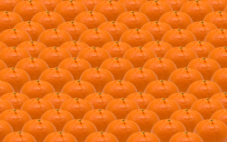 A lot of orange tangerines lined up in a row