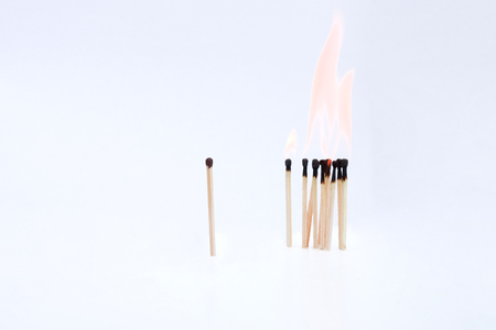 Many matches standing against a white backgroundの写真素材