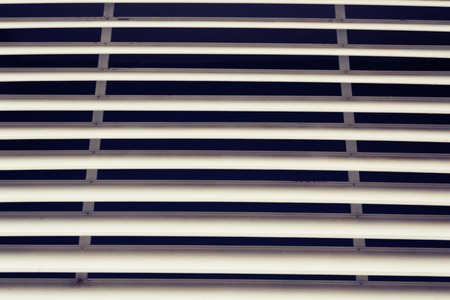 Large ventilated white grill installed on the streetの写真素材