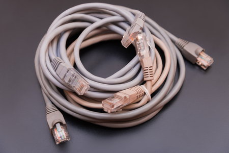 Computer gray wires on a homogeneous backgroundの写真素材