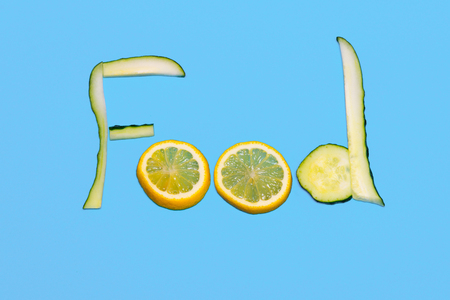 The inscription is a meal lined with cucumber and lemon on the backgroundの写真素材