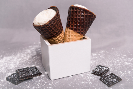 Ice cream in a horn with chocolateの写真素材