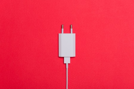 White charger with cable on the backgroundの写真素材